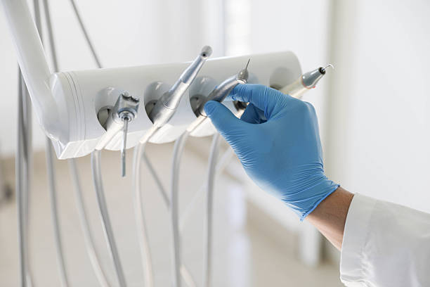 Professional Tooth Extraction technician working in Pella, IA